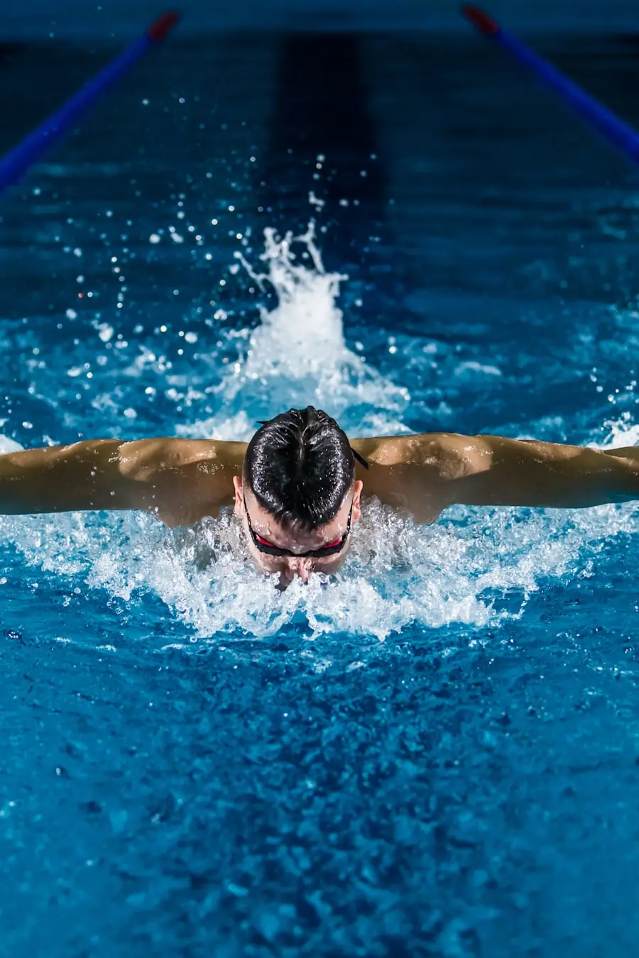 A swimming coach at the poolside